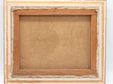 an old picture frame with a brown background and white trim