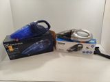 a blue and black vacuum and a box on a white surface