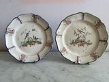 two plates that have birds on them on them