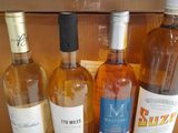 several bottles of wine are lined up in a cardboard box