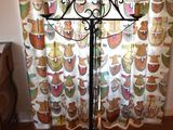 an image of a candle stand in front of a curtain