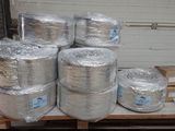 several rolls of aluminum foil sitting on top of a pallet