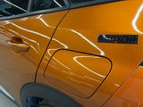 a close up of a car door with a sticker on it