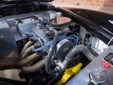 a close up of a car engine with its hood open