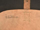 an image of a close up of a leather bag with a handle
