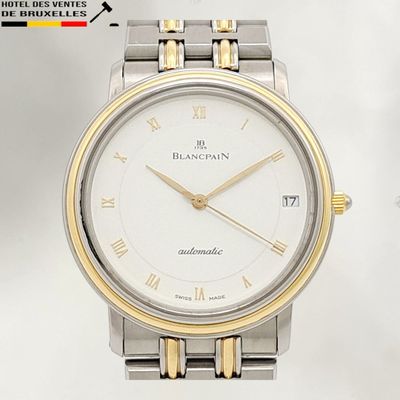 an image of a close up of a wrist watch with roman numerals