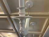 a light that is hanging from the ceiling in the room