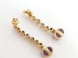 an image of a pair of gold and purple earrings