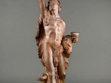 an image of a statue of a man holding a cup