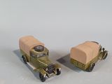 two toy cars that are sitting next to each other
