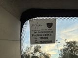 a picture of a car window with a sticker attached to it