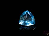 a blue topazte gems on a black background