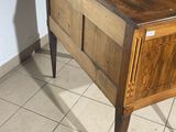 a small wooden table with a drawer on top of it