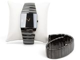 two watches and a pillow on a white background