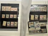 a display of stamps on display in a glass case