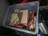 a plastic container filled with lots of papers and other items