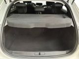 the back of a car with the trunk open and the seats folded down