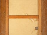 an old wooden window with a wooden frame and a window pane