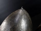 a close up of a helmet on a wooden stick