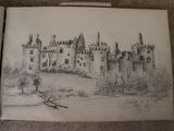 a drawing of a castle in a book on the floor