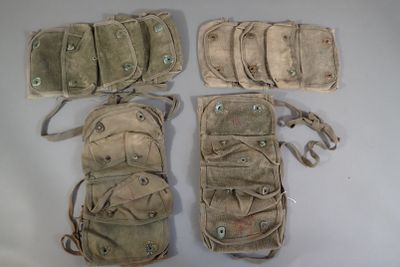 several different types of military pouchs are laid out on a white surface