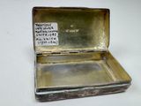 a small metal box with a label on it
