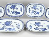six blue and white plates with flowers and leaves on them