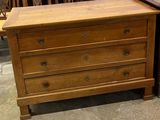 two wooden dressers sitting next to each other in a room