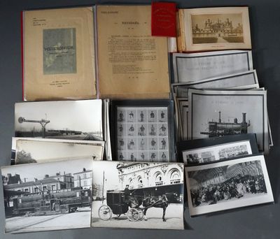 a lot of old black and white photos on the table