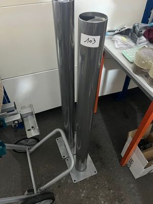 a metal pole with a number on it in a room