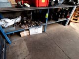 a lot of tools on a shelf in a garage
