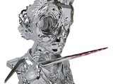 a silver statue of a woman with a knife in her hand