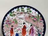 a picture of a decorative plate with asian women on it