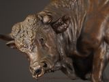 a statue of a bull that is on display