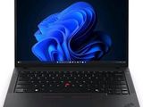 the laptop is open on a white surface with a blue background