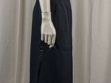 the mannequin is wearing a white shirt and black skirt
