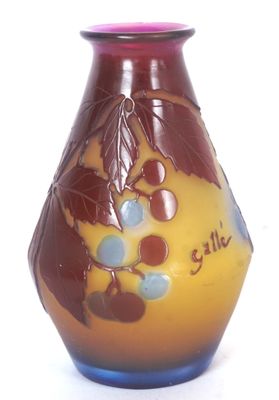 a vase with a design on it on a white surface