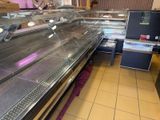 a picture of a deli counter with a lot of food in it