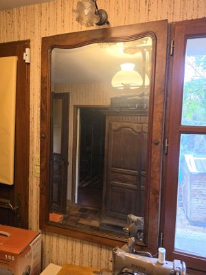 a bathroom with a sink, mirror, and a toilet in it