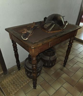 a wooden table with a helmet on top of it