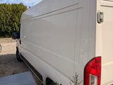a white van that is parked on the side of the road
