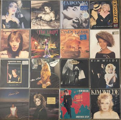 a lot of different albums on the wall