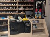 a small counter with a lot of bottles on it