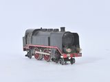 a toy train on the tracks in the snow