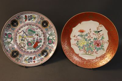 two plates with different designs on them sitting on a table