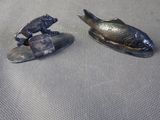 two pieces of metal that are sitting on a table