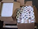 many rolls of toilet paper in a box on the floor
