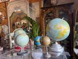 many different types of globes on display in this room