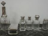 a lot of glass bottles and salt shakers on the counter