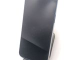 a cell phone that is sitting on top of a stand